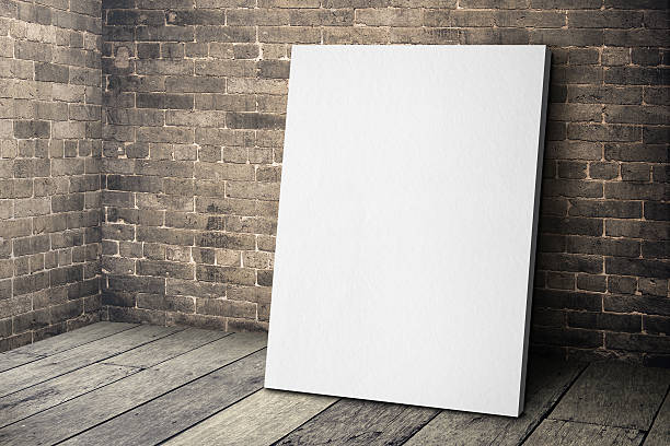 istock white frame leaning at grunge brick wall and wood floor 585292882