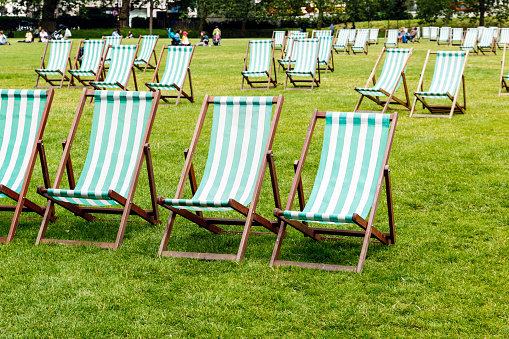 Green stripped deck chairs in Green Park, London