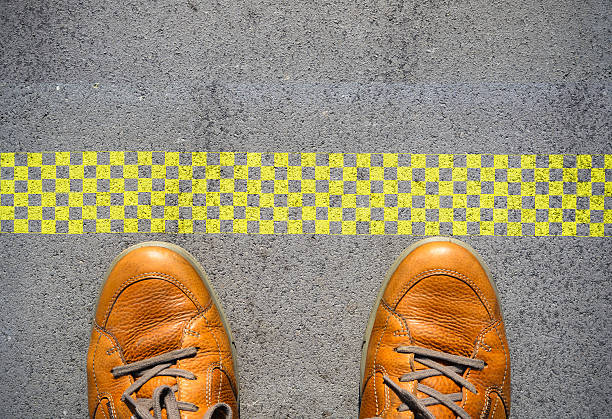 istock Start new career concept with man feet at start line 585298604