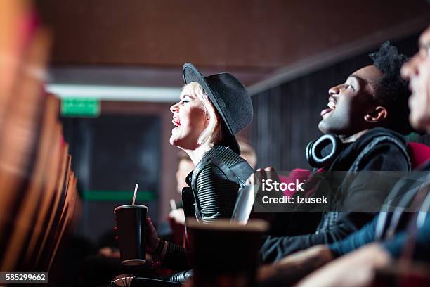 Multi Ethnic Young People In The Movie Theater Stock Photo - Download Image Now - Movie Theater, Drinking, Movie