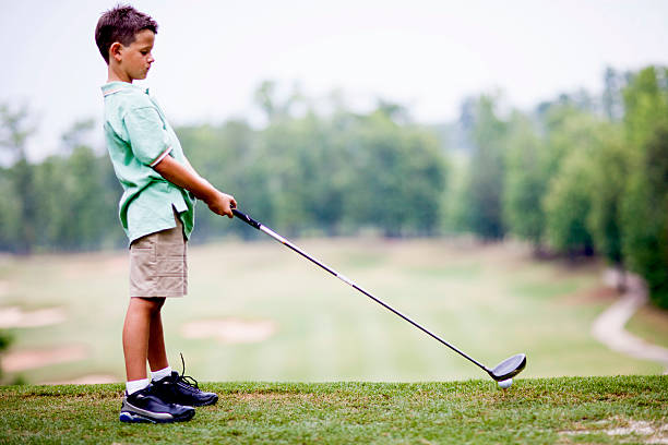 istock Grandson and Grandfather Playing Golf 585300754