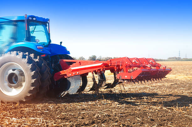 istock Tractor in a field, autumn sunny day 585301078