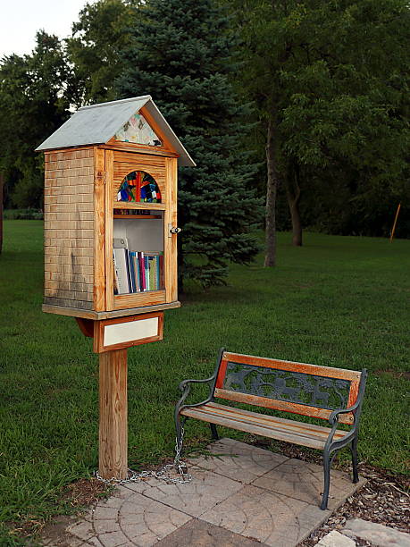 Sidewalk Library in Residential Neighborhood A tiny library in a church yard to promote reading and literacy. free of charge photos stock pictures, royalty-free photos & images