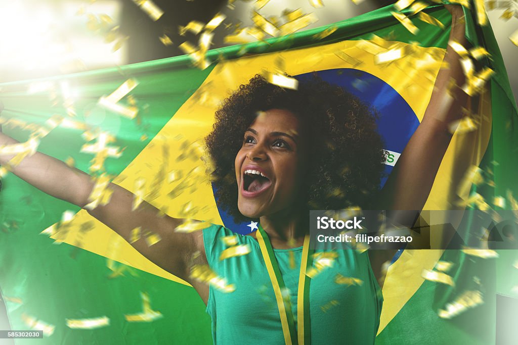 Brazilian woman celebrating in the stadium Brazilian sport collection Adult Stock Photo