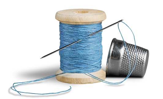 Spool of Thread with Needle and Thimble