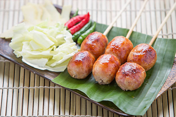 istock Isaan sausage on wood background. 585303712