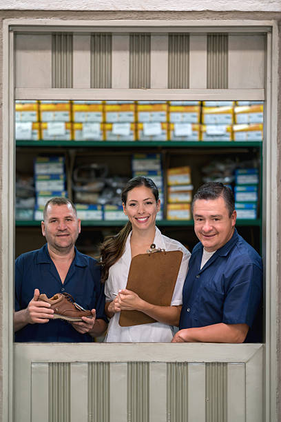 istock Group of people working at a factory 585304814