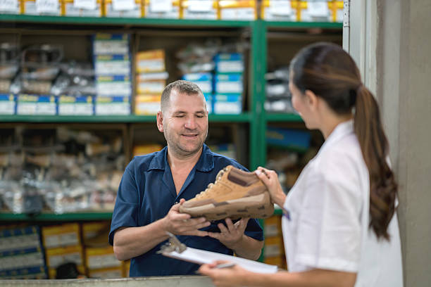 istock Quality control inspector at a shoe-making factory 585304838