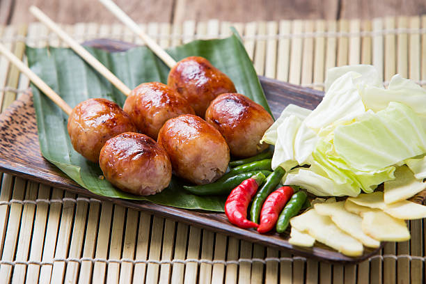 istock Isaan pork sausage recipe with side dishes. 585304932