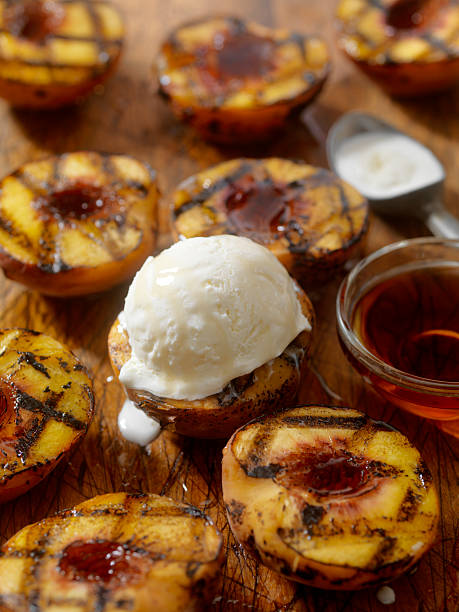istock Grilled Peaches with Vanilla Ice Cream and Maple Syrup 585306444