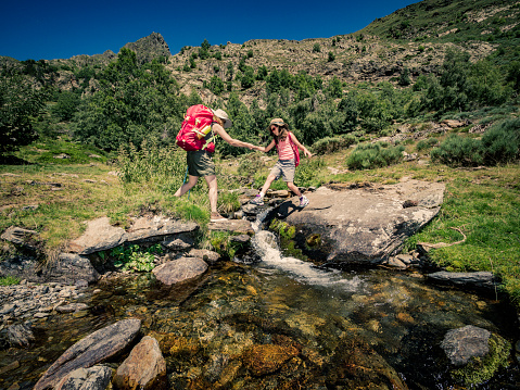 Mother and her daughter trekking in the mountains