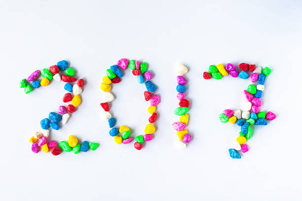 istock New year 2017 with colorful stone on white background. 585310376