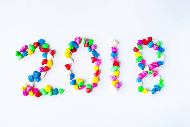 istock New year 2018 with colorful stone on white background. 585310406
