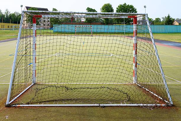 istock Empty gate. Outdoor football or handball playground, 585311020