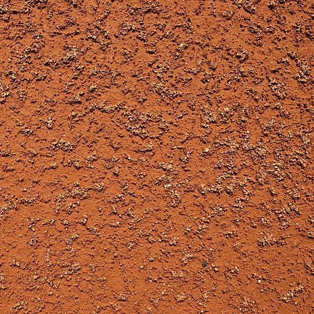 istock Dry light red crushed bricks surface on outdoor tennis court. 585312030