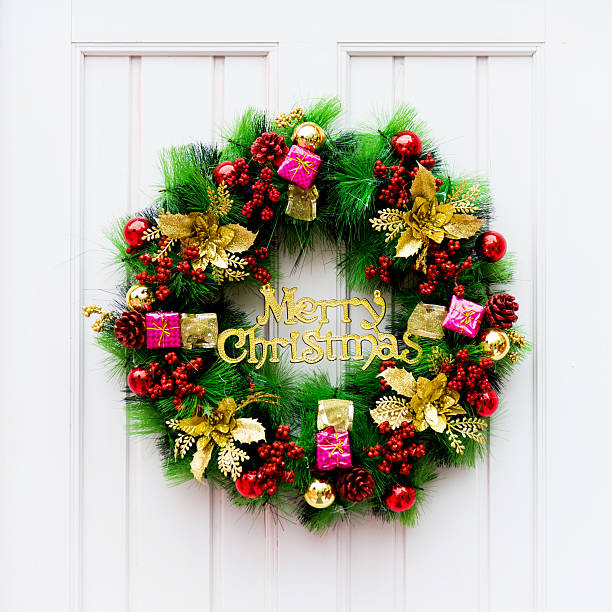 istock Christmas decoration on front door 585312906
