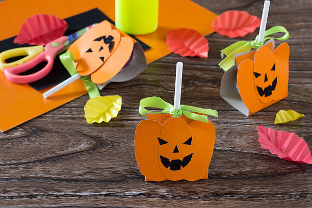 istock The child create a greeting packaging for lollipop on Halloween 585313508
