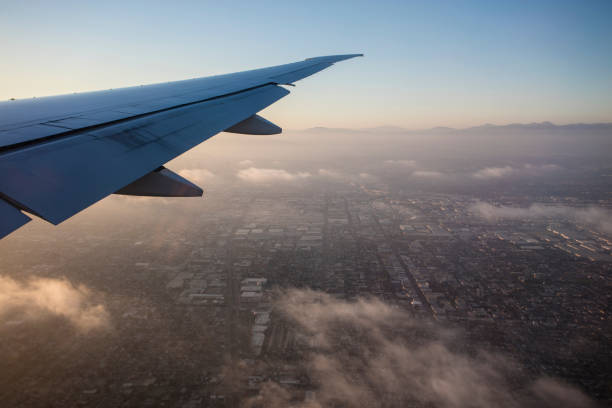 istock Plane Flying over Los Angeles 585313570