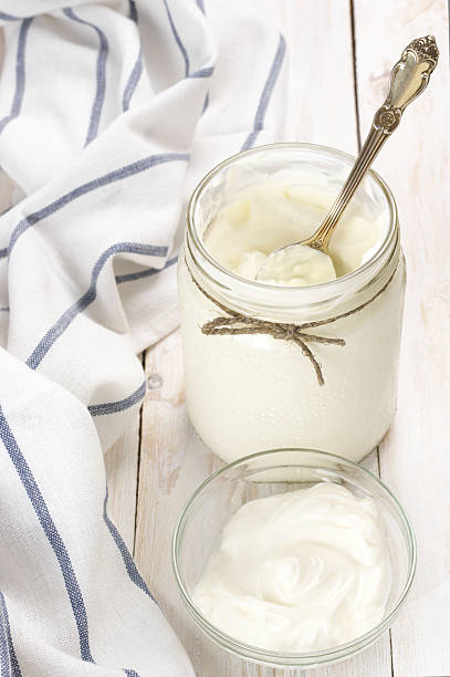istock Sour cream in jar and bowl 585314798