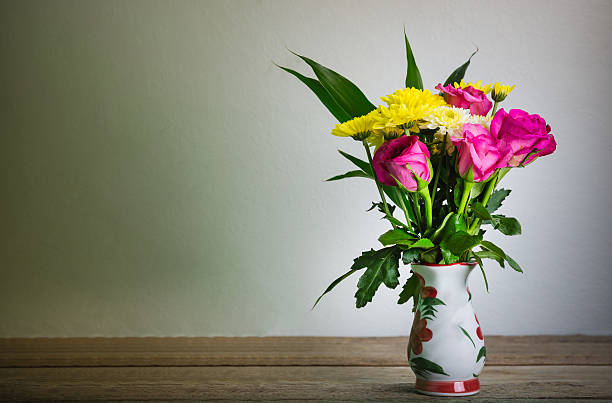 istock vase flowers rose Daisy 585316204