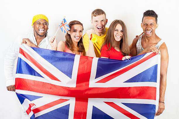 istock Group of multiracial people holding a England flag 585316264
