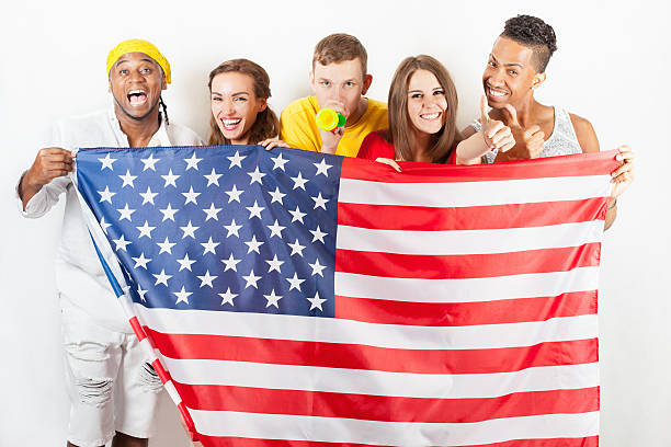 istock Group of multiracial people holding a american flag 585317222
