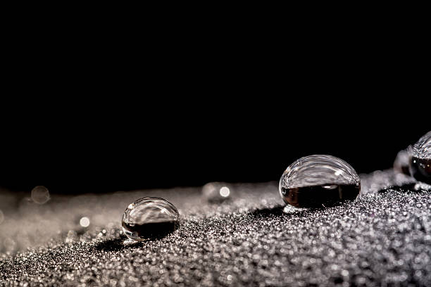 gotas de água close-up macro no material - impermeável repelente de água - fotografias e filmes do acervo