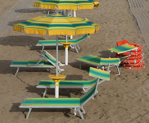 istock umbrellas in sandy beach seen from above 585319646