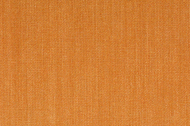 istock Orange decorative canvas fabric texture background, close up 585320688