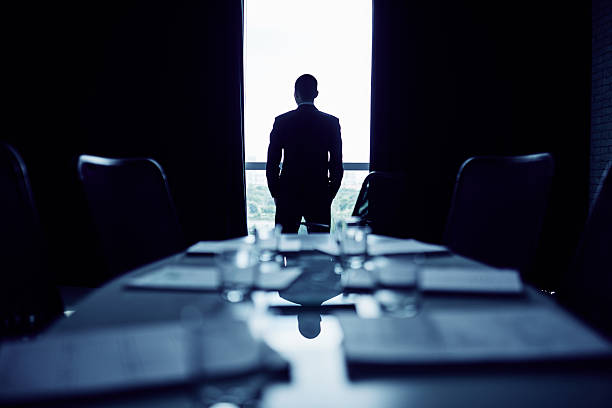 Before meeting Businessman making up his mind before important meeting business people silhouette stock pictures, royalty-free photos & images