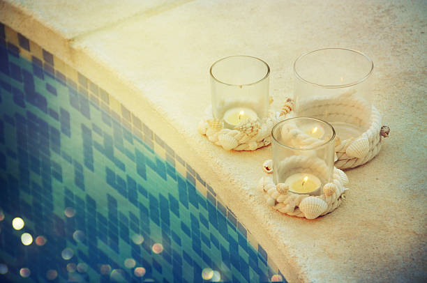 istock Summer outdoor decoration with sea shell and candles 585321790