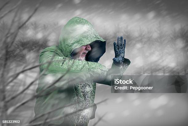 Adventurous Man Caught In Snowstorm Or Winter Blizzard Stock Photo - Download Image Now