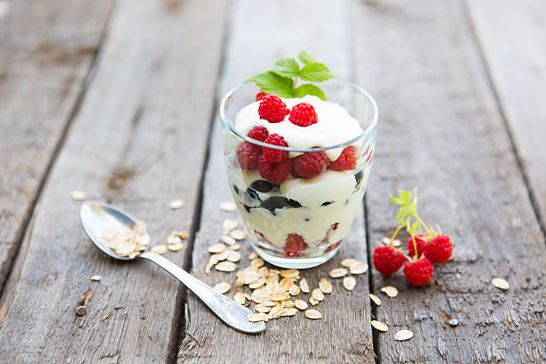 istock Natural yogurt with fresh raspberries, black currant and muesli. 585324090