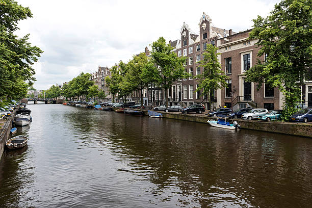 istock Amsterdam tranquil canal scene, Netherlands 585324504