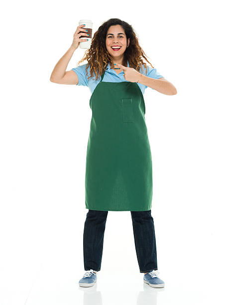 istock Smiling barista pointing at coffee cup 585324800