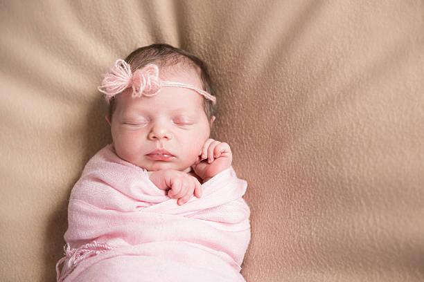 istock Newborn baby sleeping closeup 585325198