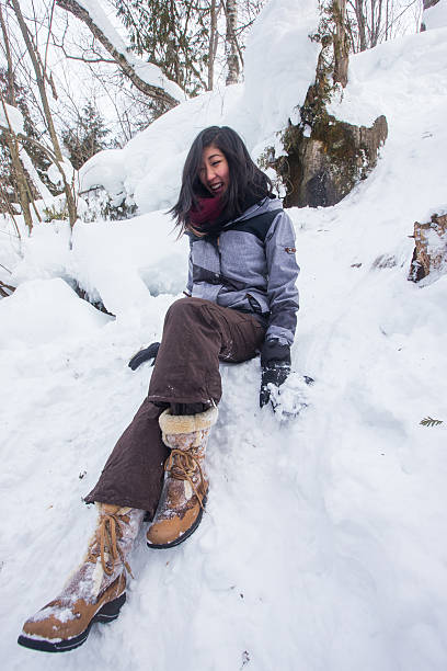 istock Asian couple hiking in the winter 585325366