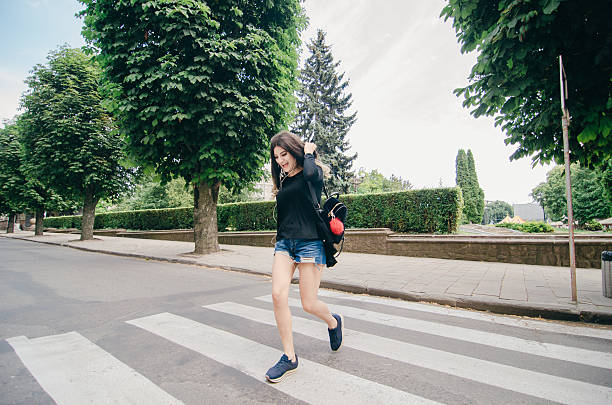 istock girl walking in the city 585326464