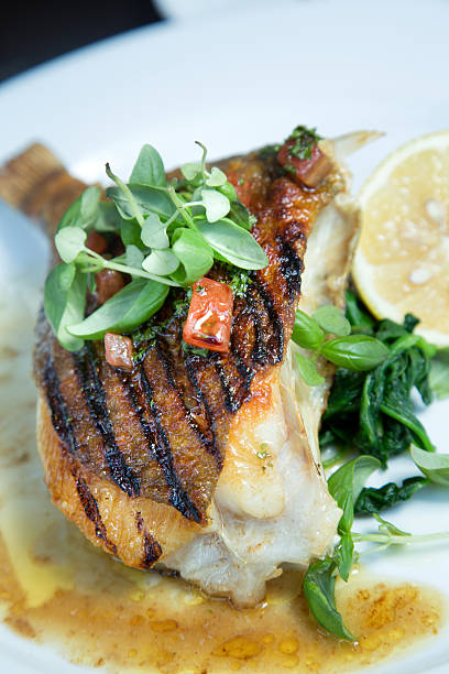 istock Grilled John Dory Fish Steak With Thyme And Lemon 585327542