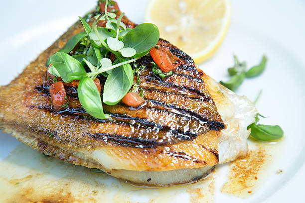 istock Grilled John Dory Fish Steak With Thyme And Lemon 585327584