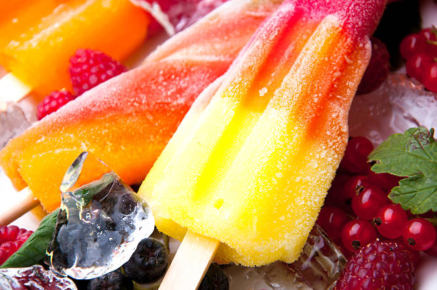 Composition of delicious ice cream, fruits and ice cubes