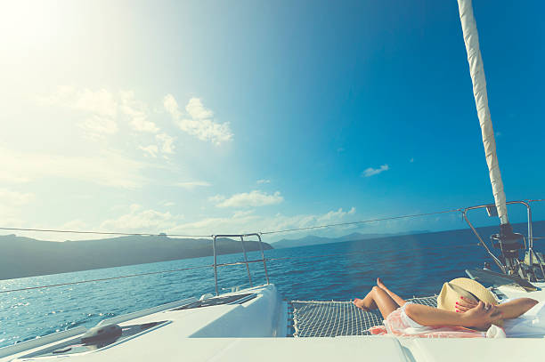 istock Woman relaxing on a sailboat. 585328498