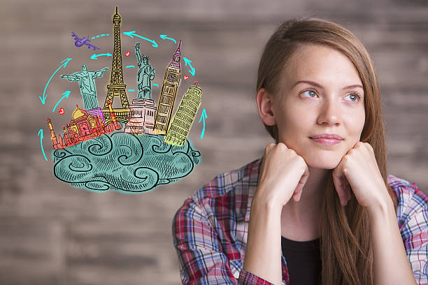 istock Young woman daydreaming about holidays 585329060