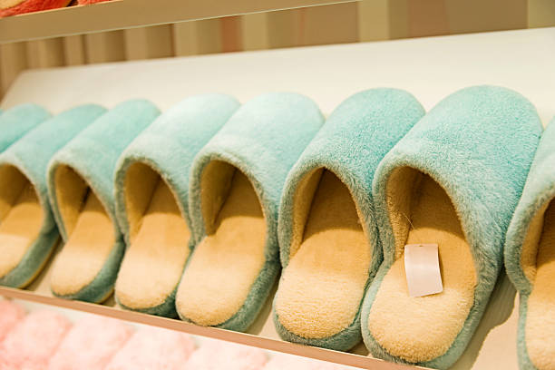 Many slippers in a store.