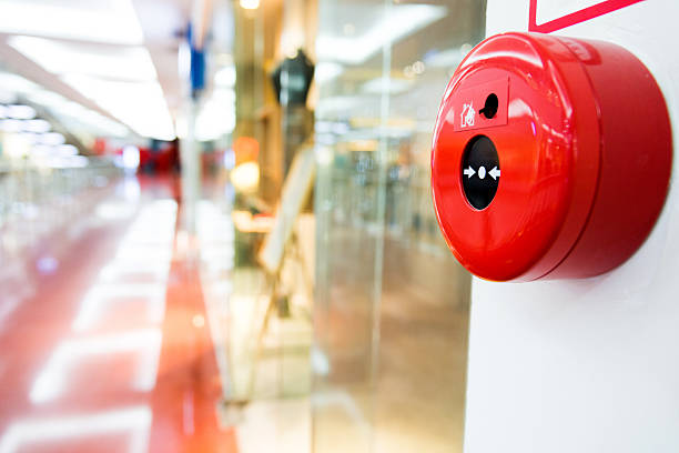 istock Fire alarm button on wall of shopping center 585479562