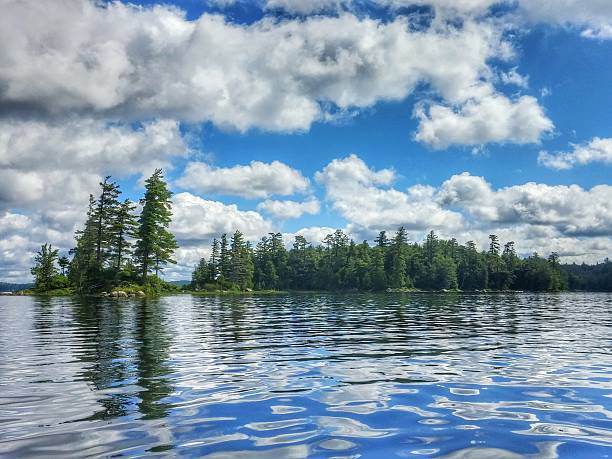 Raquette Lake Cloud, Sky, Island Trees Reflection, Adirondacks, New York stock photo