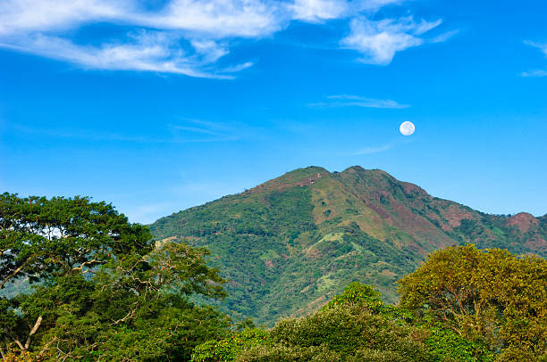 Early morning Central American landscape with volcano in the distance.