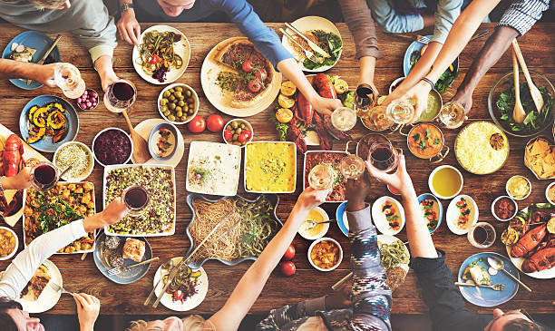 istock Friends Happiness Enjoying Dinning Eating Concept 585482828