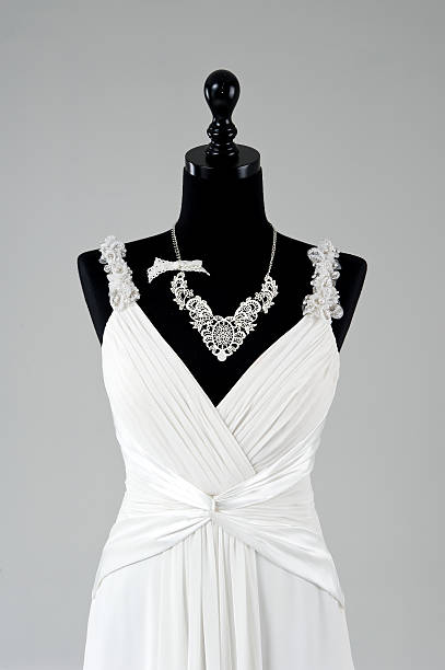 istock Modern white wedding dress isolated on Grey background 585484924