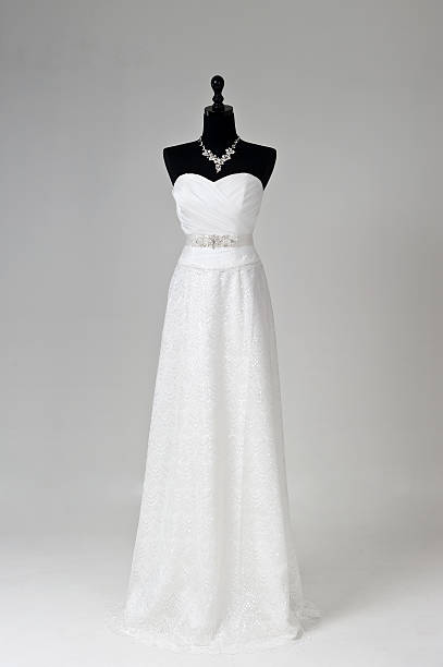 istock Modern white wedding dress isolated on Grey background 585485112